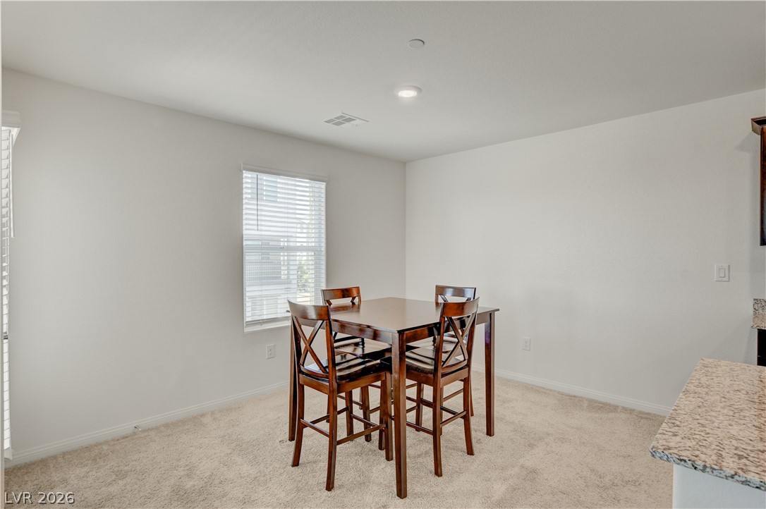 6924 Spicy Merlot Street North Las Vegas, NV 89086 - Photo 10 of 83 A well-lit breakfast area offers comfortable dining with ample natural illumination.