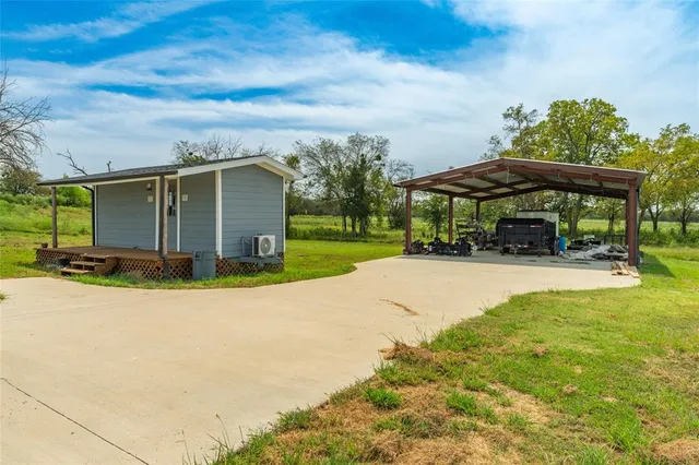 a view of house with yard and entertaining space