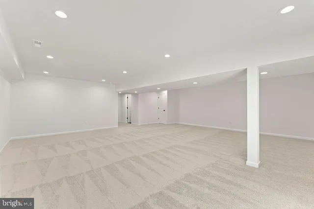 a view of a house with a yard covered in snow