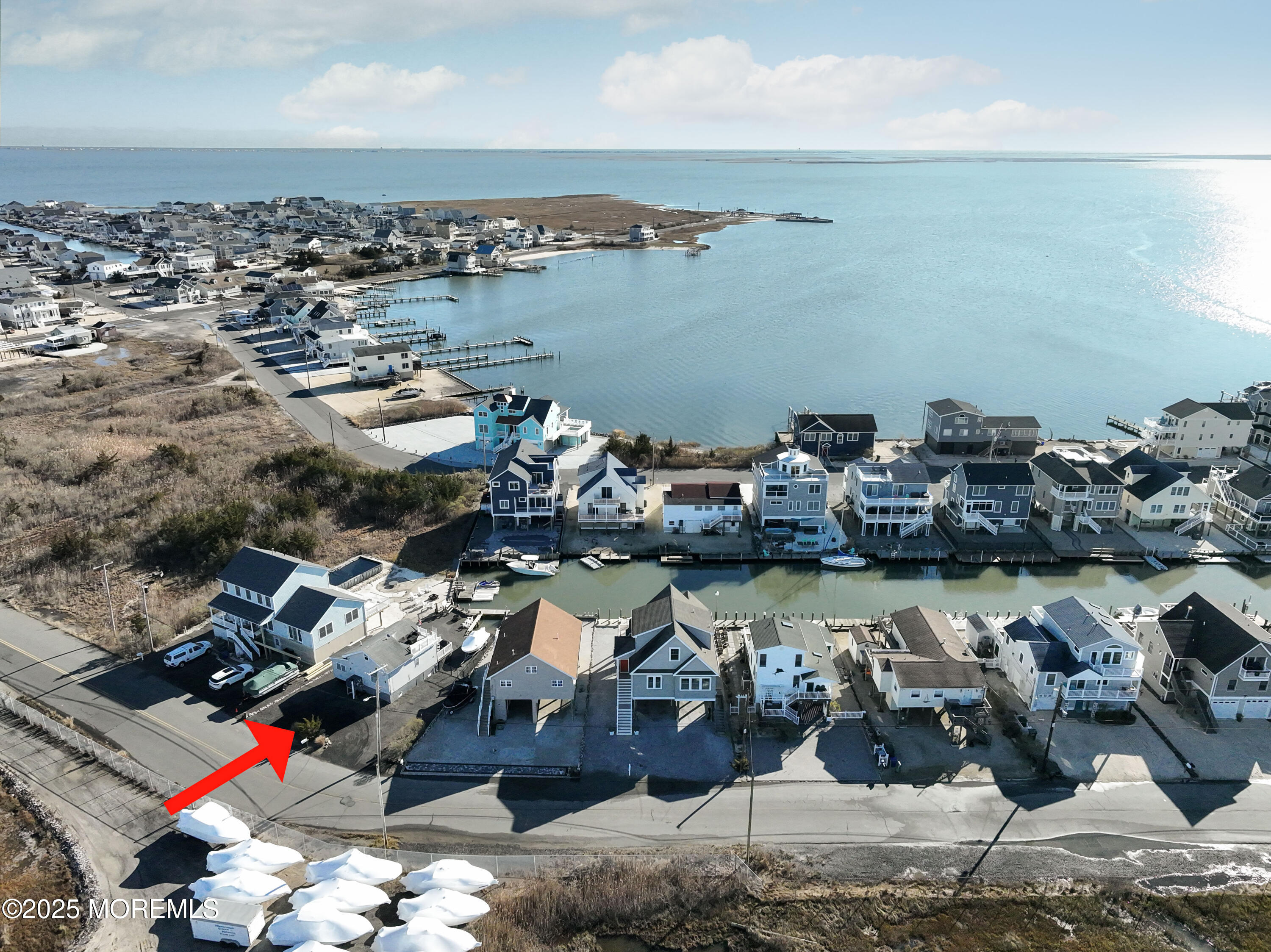 25 B Carroll Avenue Tuckerton, NJ 08087 - Photo 26 of 27 a view of a lake with boats and trees in the background