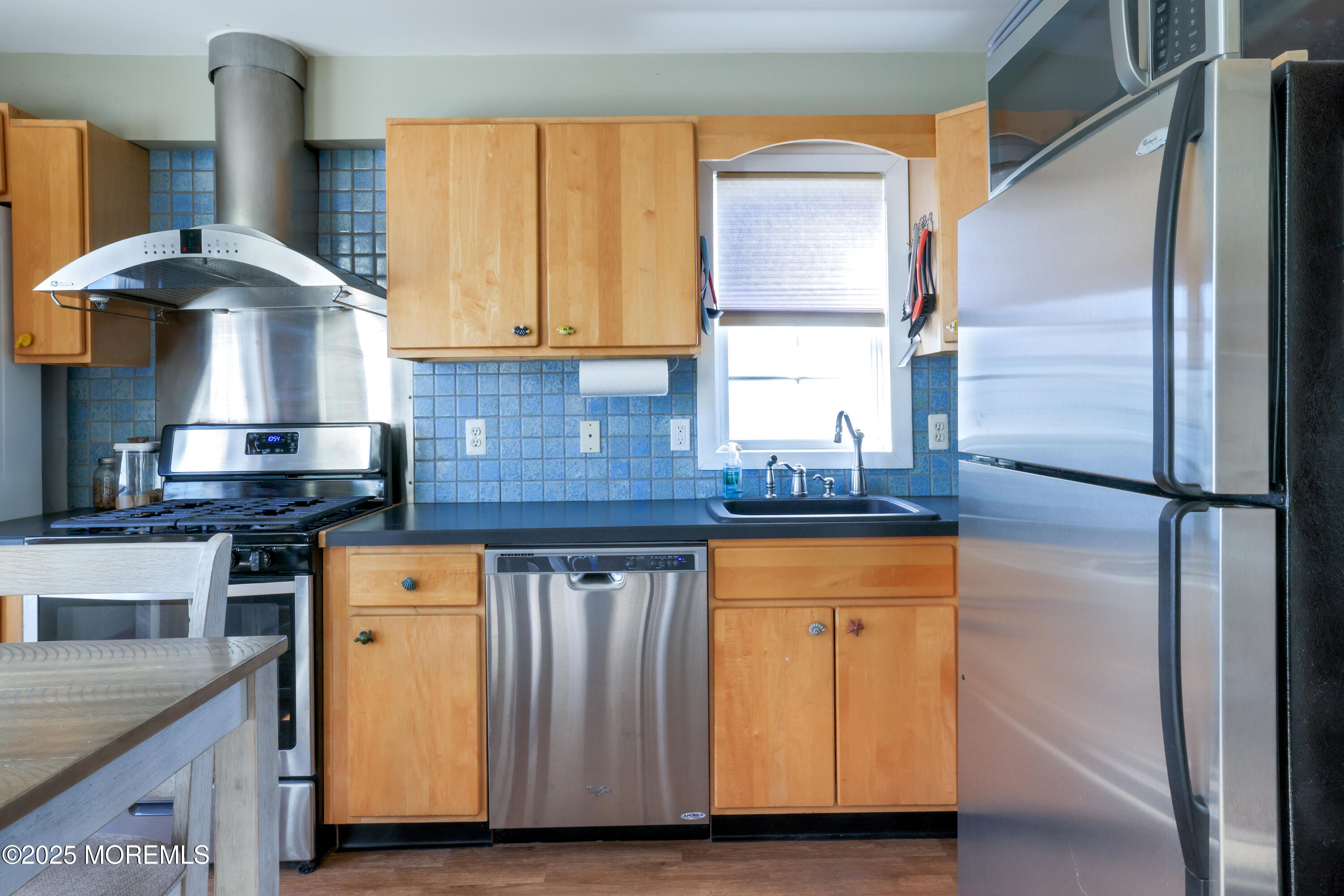 25 B Carroll Avenue Tuckerton, NJ 08087 - Photo 7 of 27 a kitchen with stainless steel appliances granite countertop a stove a refrigerator and a sink