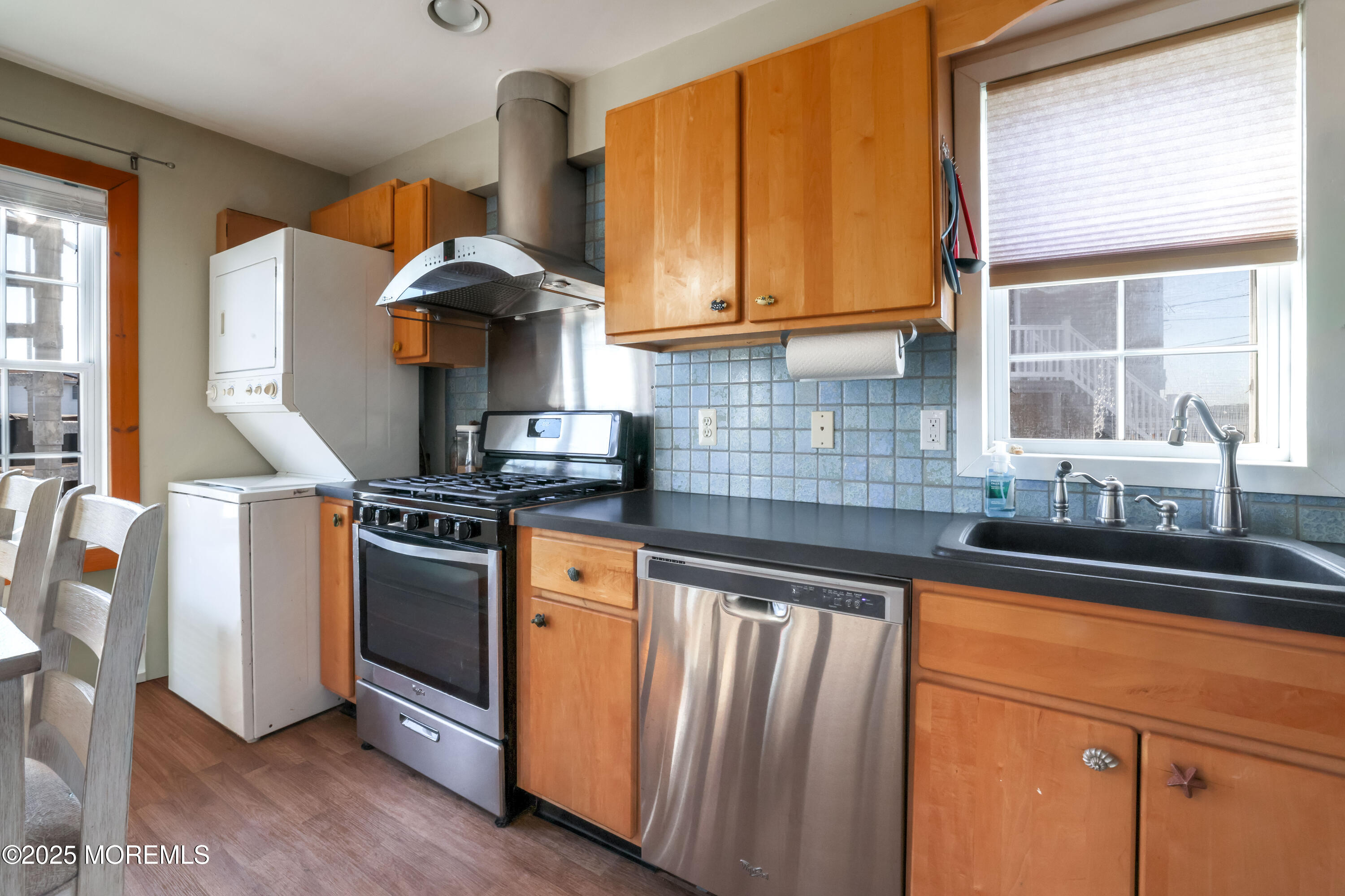 25 B Carroll Avenue Tuckerton, NJ 08087 - Photo 8 of 27 a kitchen with stainless steel appliances granite countertop a sink and a stove