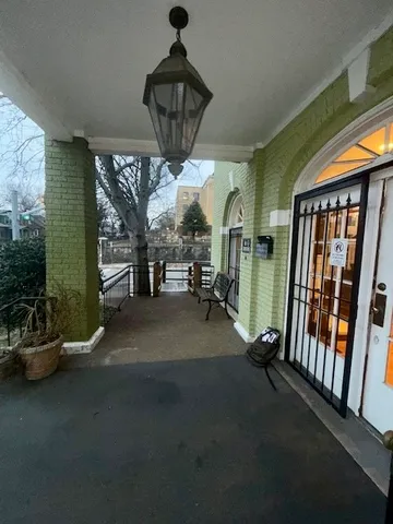 a view of lobby with furniture and chandelier