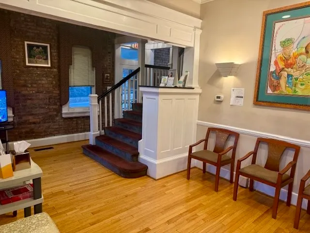 a view of staircase with furniture and rug