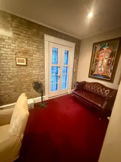 a living room with furniture pool table and a fireplace