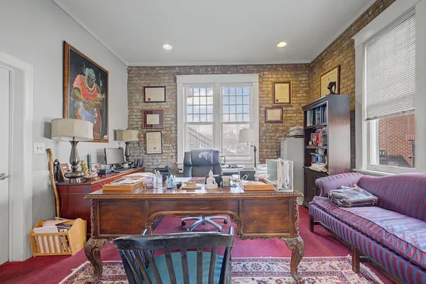 a dining room with furniture and window