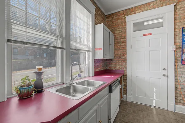 a kitchen with a sink and a window