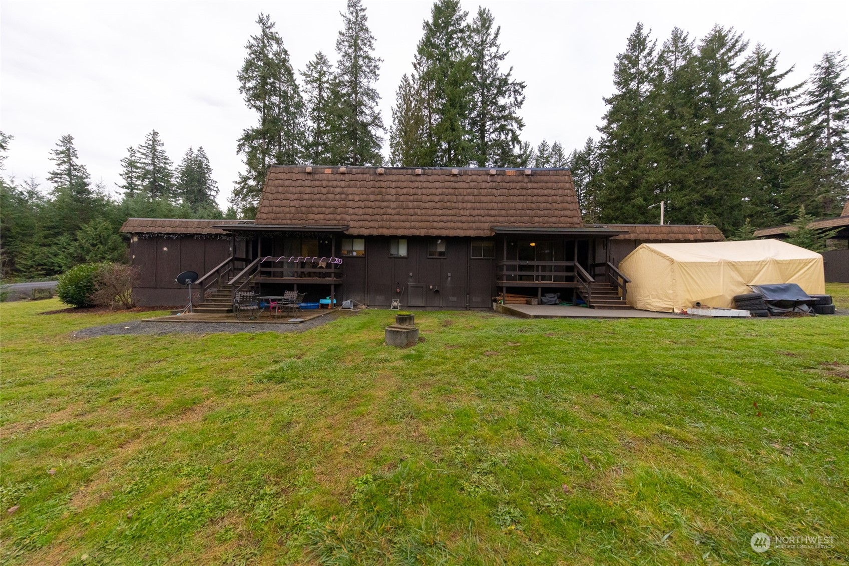 168 Chilvers E & F Road Chehalis, WA 98532 - Photo 27 of 29 a view of a patio with table and chairs a barbeque with wooden fence