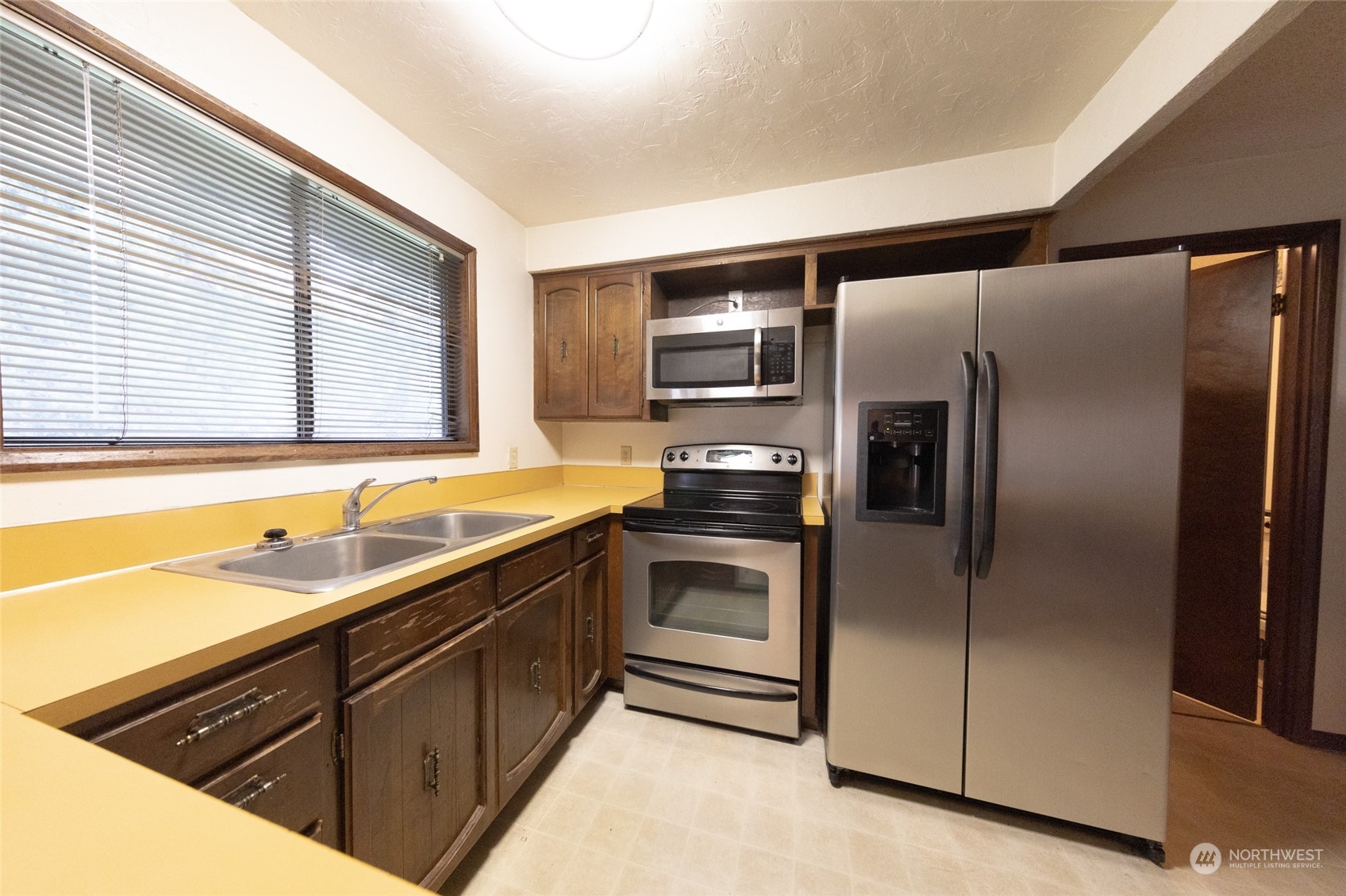 168 Chilvers E & F Road Chehalis, WA 98532 - Photo 8 of 29 a kitchen with stainless steel appliances granite countertop a refrigerator and a sink