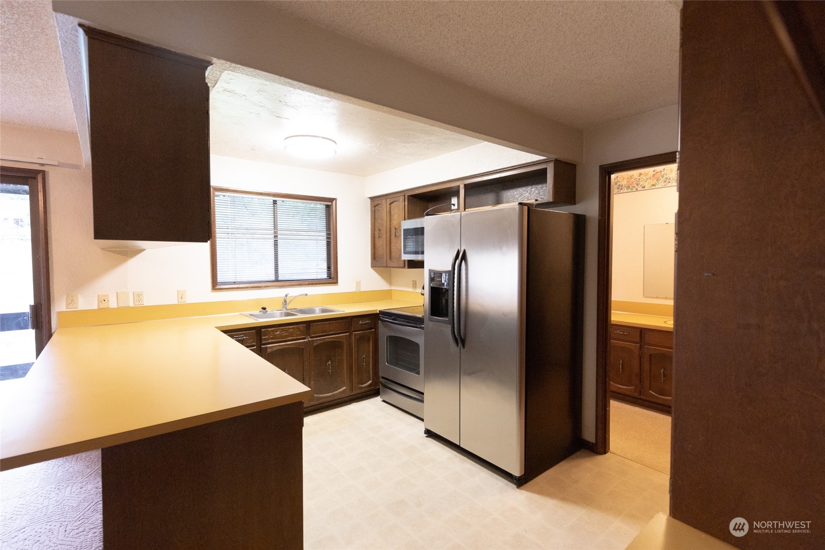 168 Chilvers E & F Road Chehalis, WA 98532 - Photo 10 of 29 a kitchen with stainless steel appliances granite countertop a refrigerator and a stove