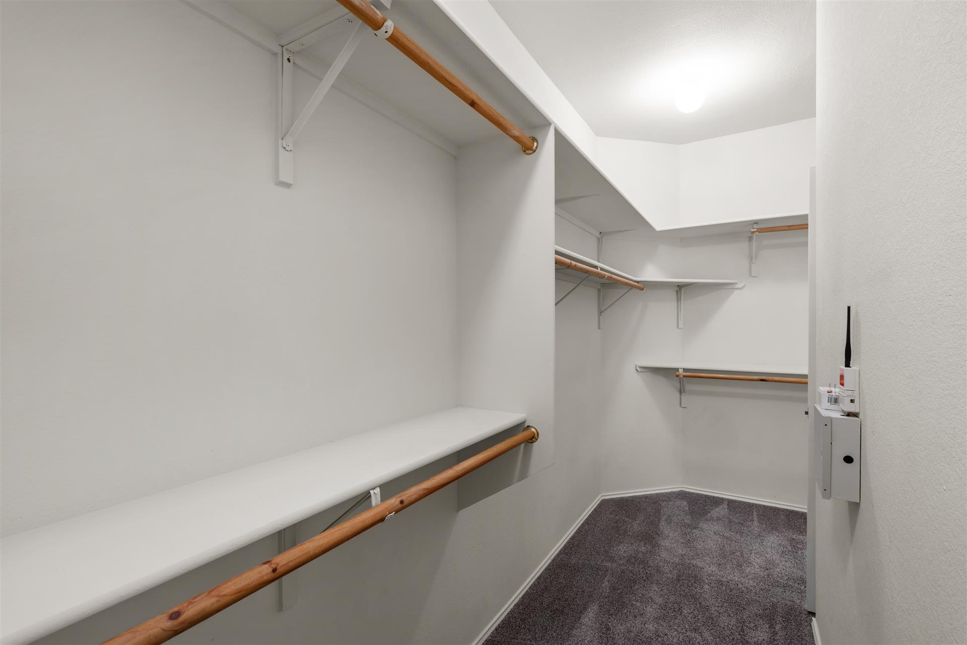 4725 Tello Path Austin, TX 78749 - Photo 22 of 34 Ample shelving and hanging space in this well-appointed closet maximizes organization.