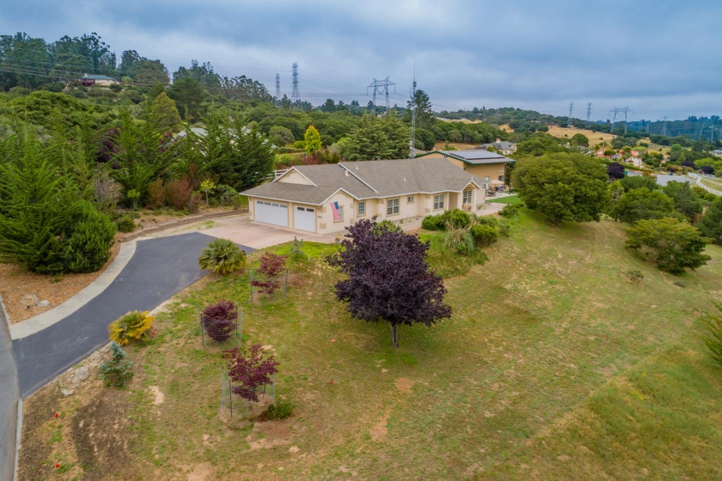 an aerial view of a house with a garden