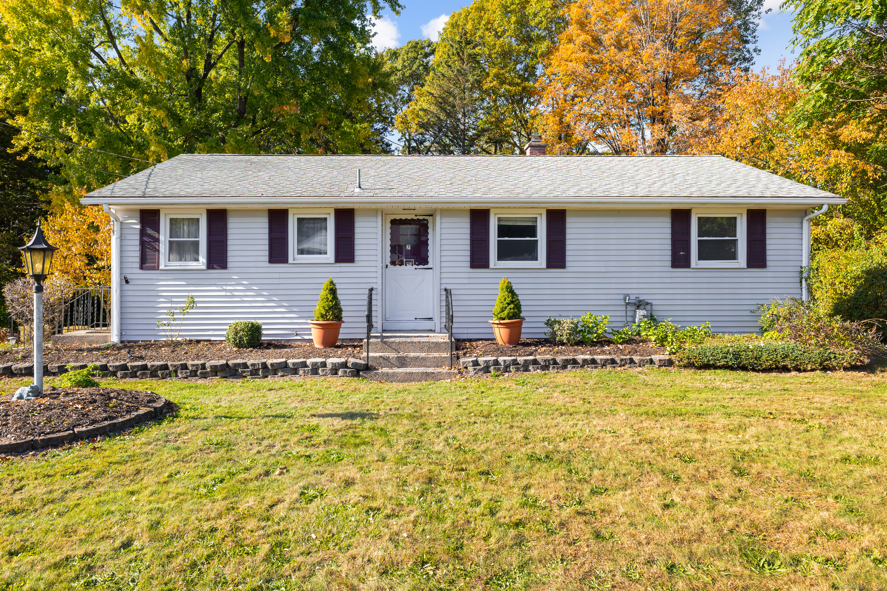 a front view of house with yard outdoor seating and barbeque oven