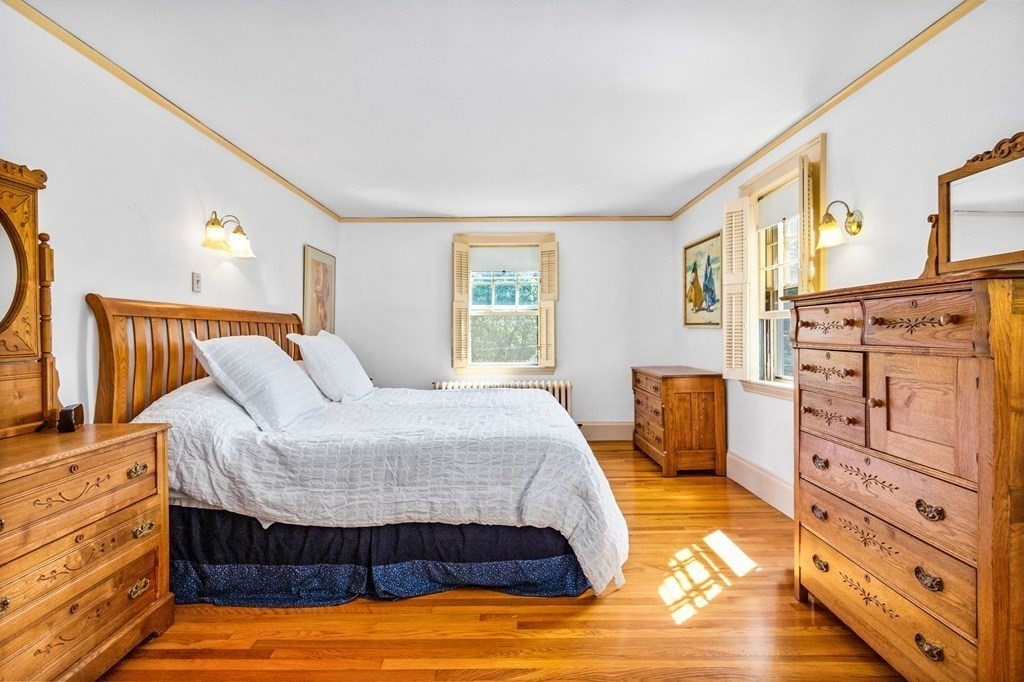 27 Whitney Road Newton, MA 02460 - Photo 16 of 32 a bedroom with a bed and a dresser