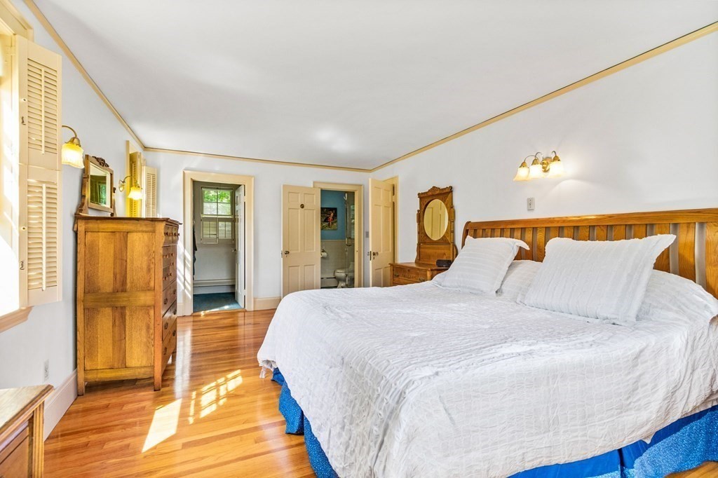 27 Whitney Road Newton, MA 02460 - Photo 17 of 32 a bedroom with a bed and wooden floor