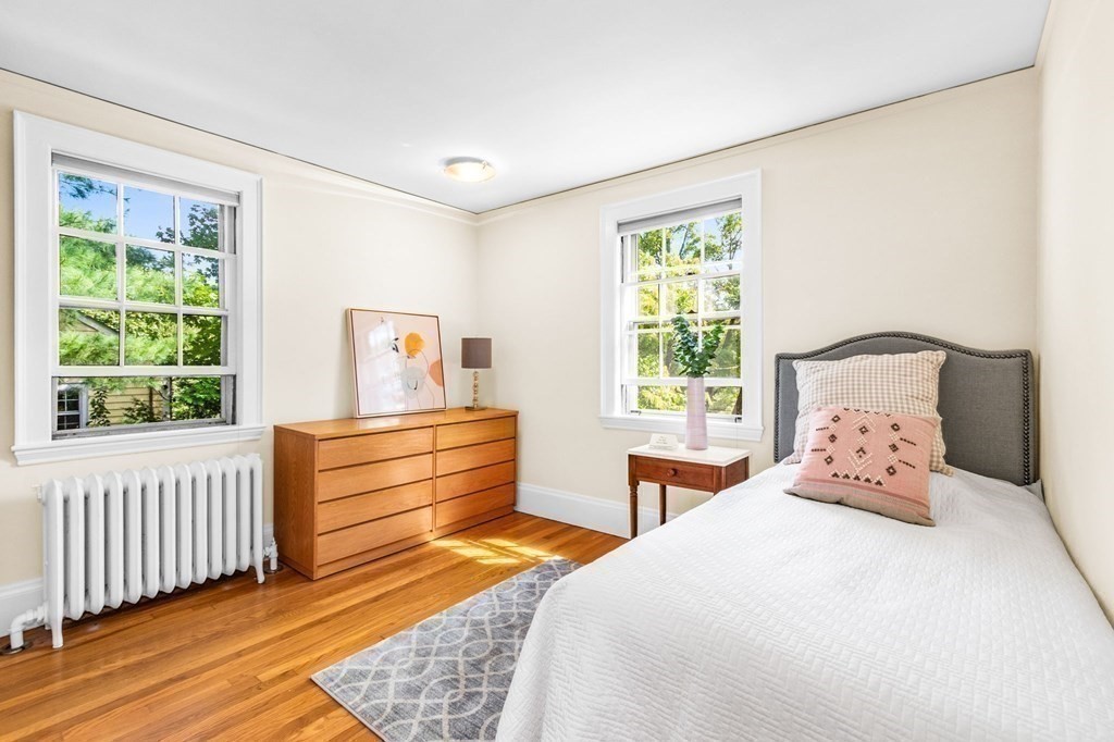 27 Whitney Road Newton, MA 02460 - Photo 20 of 32 a bedroom with a bed and a window