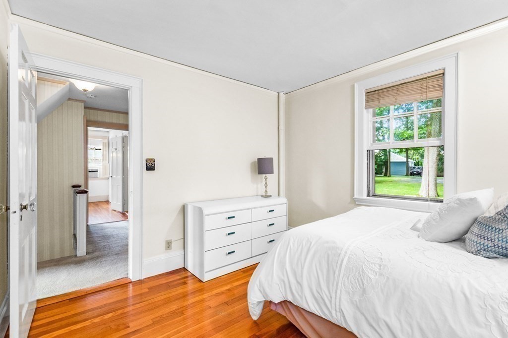 27 Whitney Road Newton, MA 02460 - Photo 21 of 32 a bedroom with a bed and a dresser