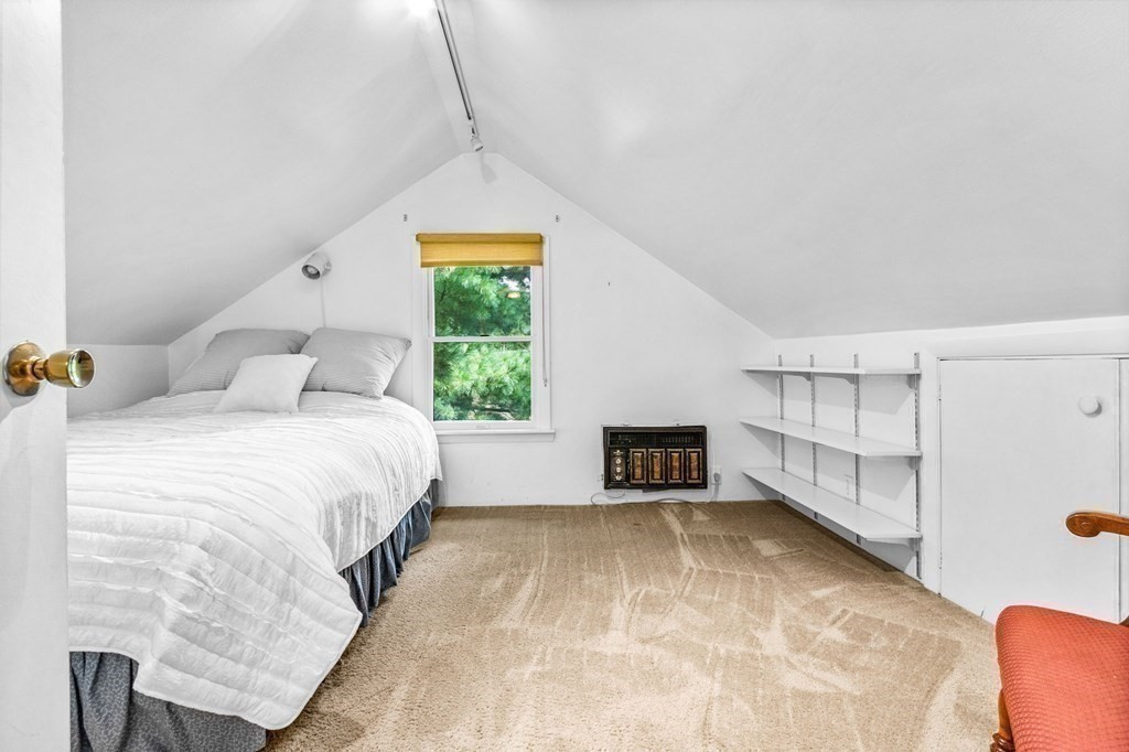 27 Whitney Road Newton, MA 02460 - Photo 24 of 32 a spacious bedroom with a bed and a window