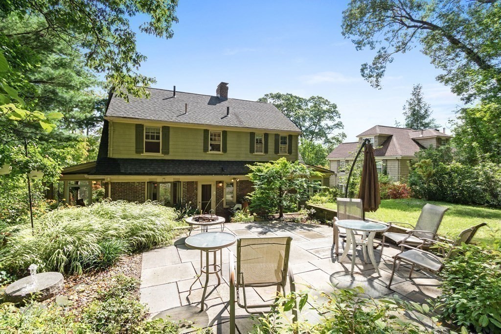 27 Whitney Road Newton, MA 02460 - Photo 28 of 32 a view of a patio with table and chairs and potted plants