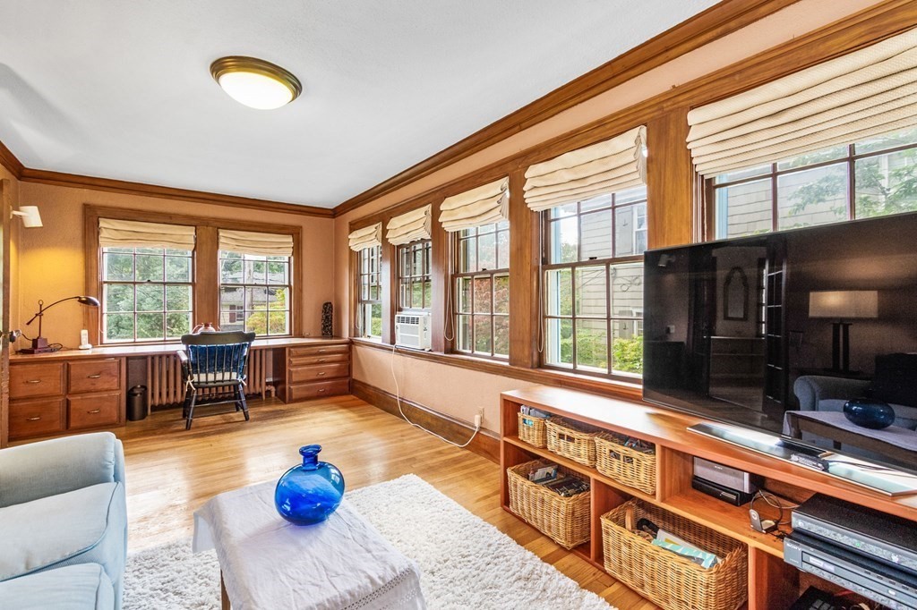 27 Whitney Road Newton, MA 02460 - Photo 8 of 32 a living room with furniture and floor to ceiling windows