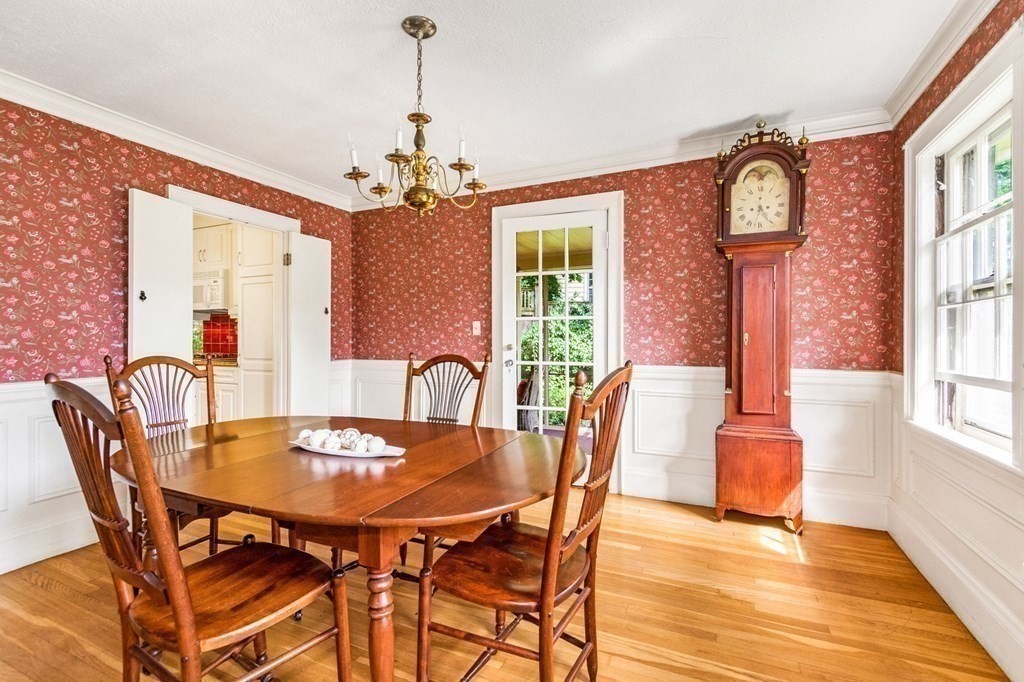 27 Whitney Road Newton, MA 02460 - Photo 10 of 32 a dining room with furniture a chandelier and wooden floor