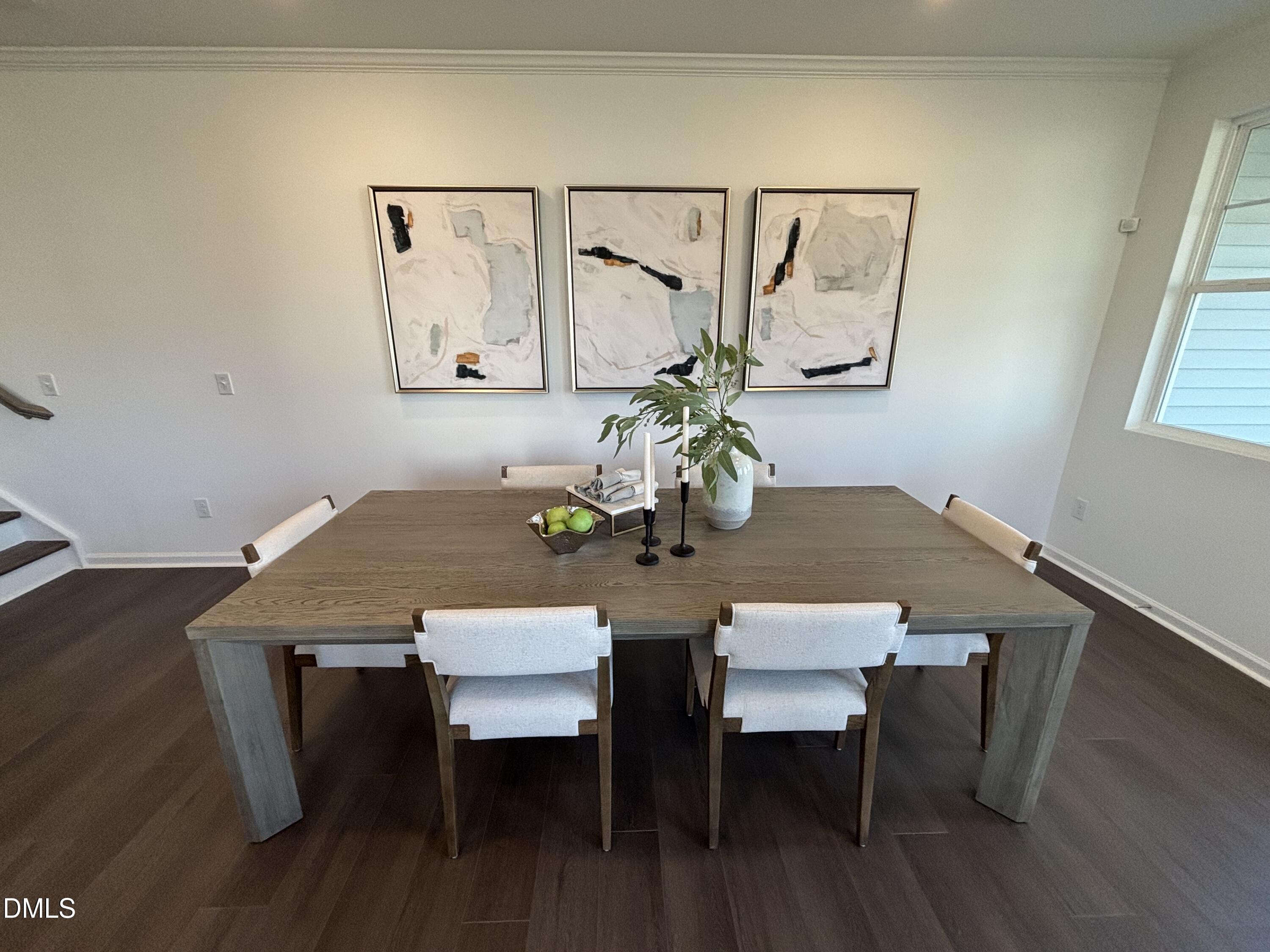 162 Blossom Fld Way Angier, NC 27501 - Photo 11 of 45 a view of a dining room with furniture and wooden floor