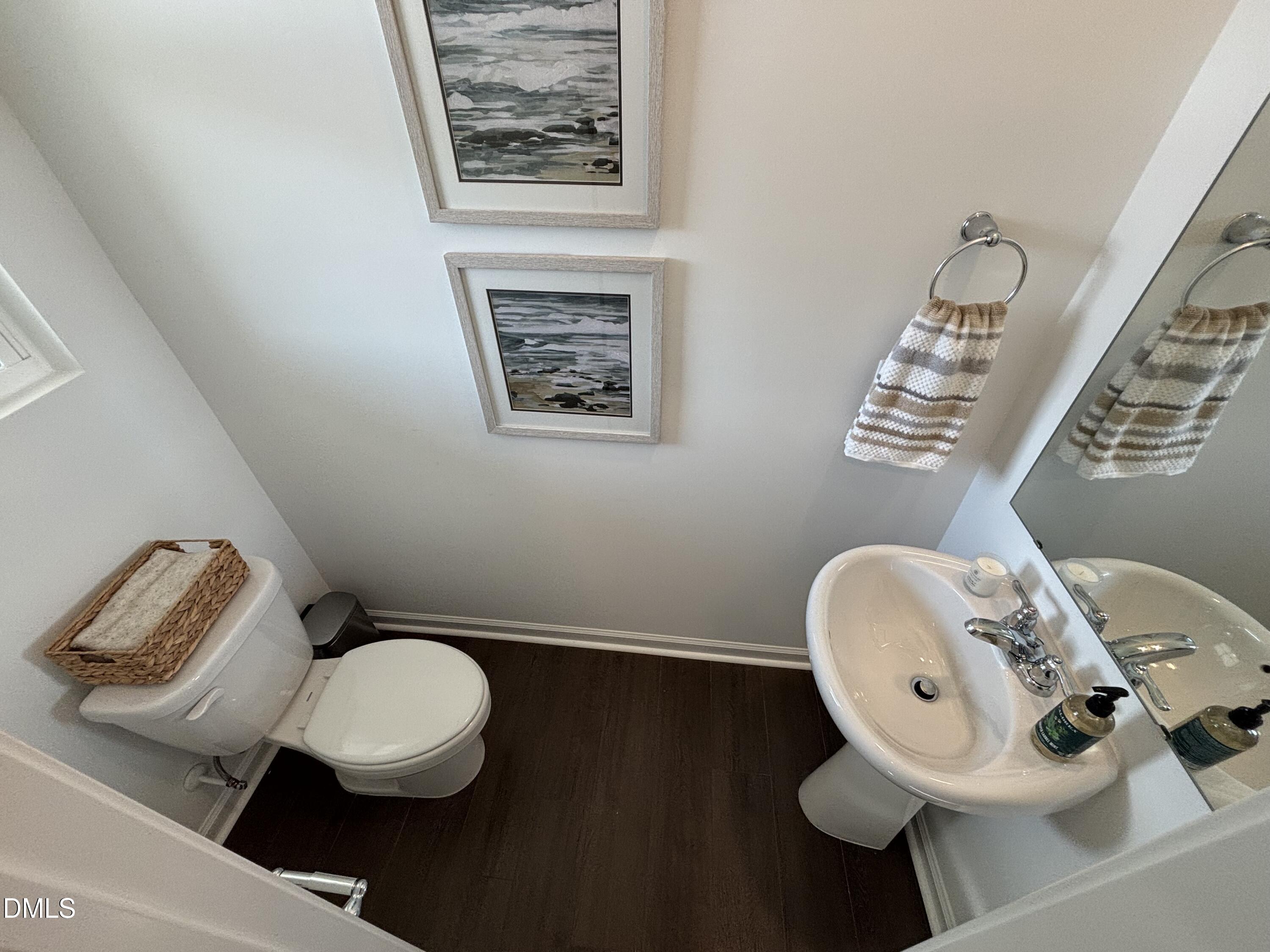 162 Blossom Fld Way Angier, NC 27501 - Photo 26 of 45 a bathroom with a toilet sink and mirror