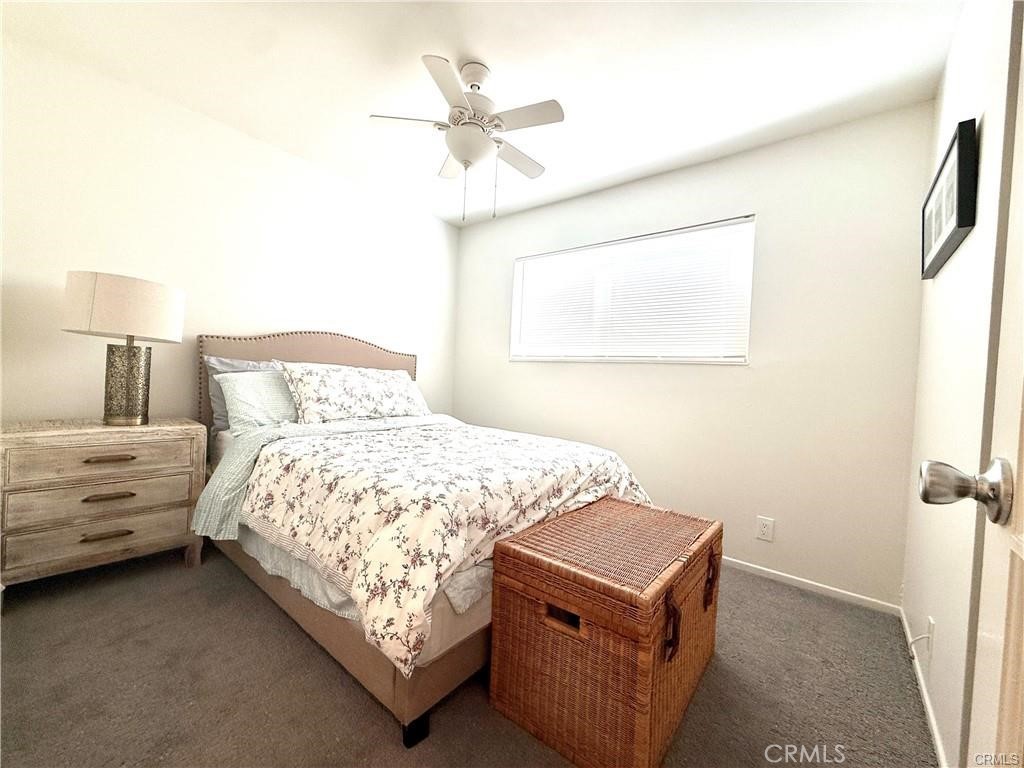 14901 Waverly Lane Irvine, CA 92604 - Photo 11 of 13 a bedroom with a bed and a chandelier