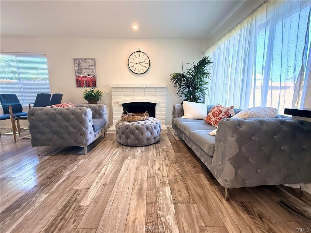 14901 Waverly Lane Irvine, CA 92604 - Photo 3 of 13 a living room with furniture and a fireplace