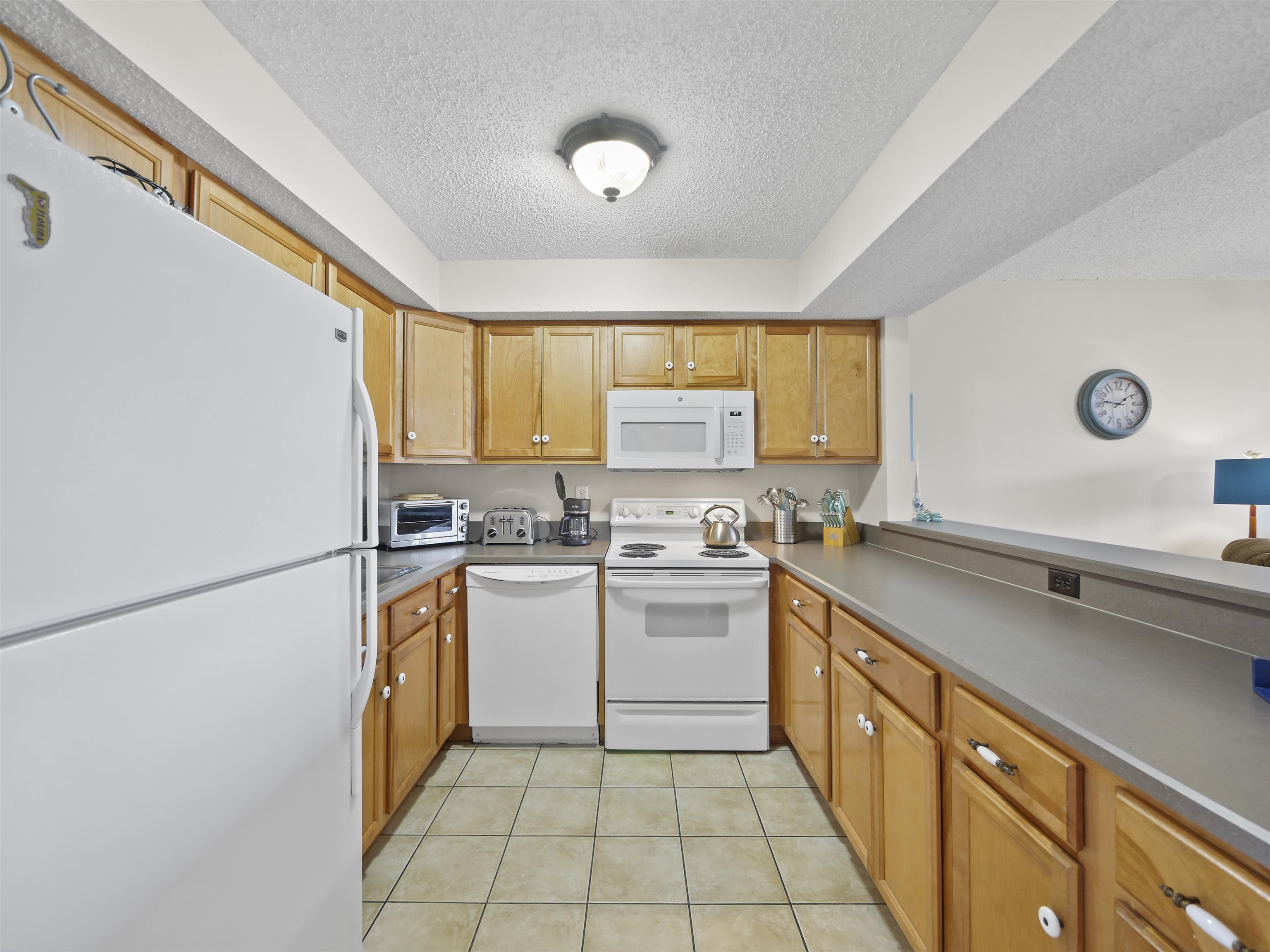 7175 A1A South St. Augustine, FL 32080 - Photo 12 of 35 a kitchen with a sink appliances cabinets and a window