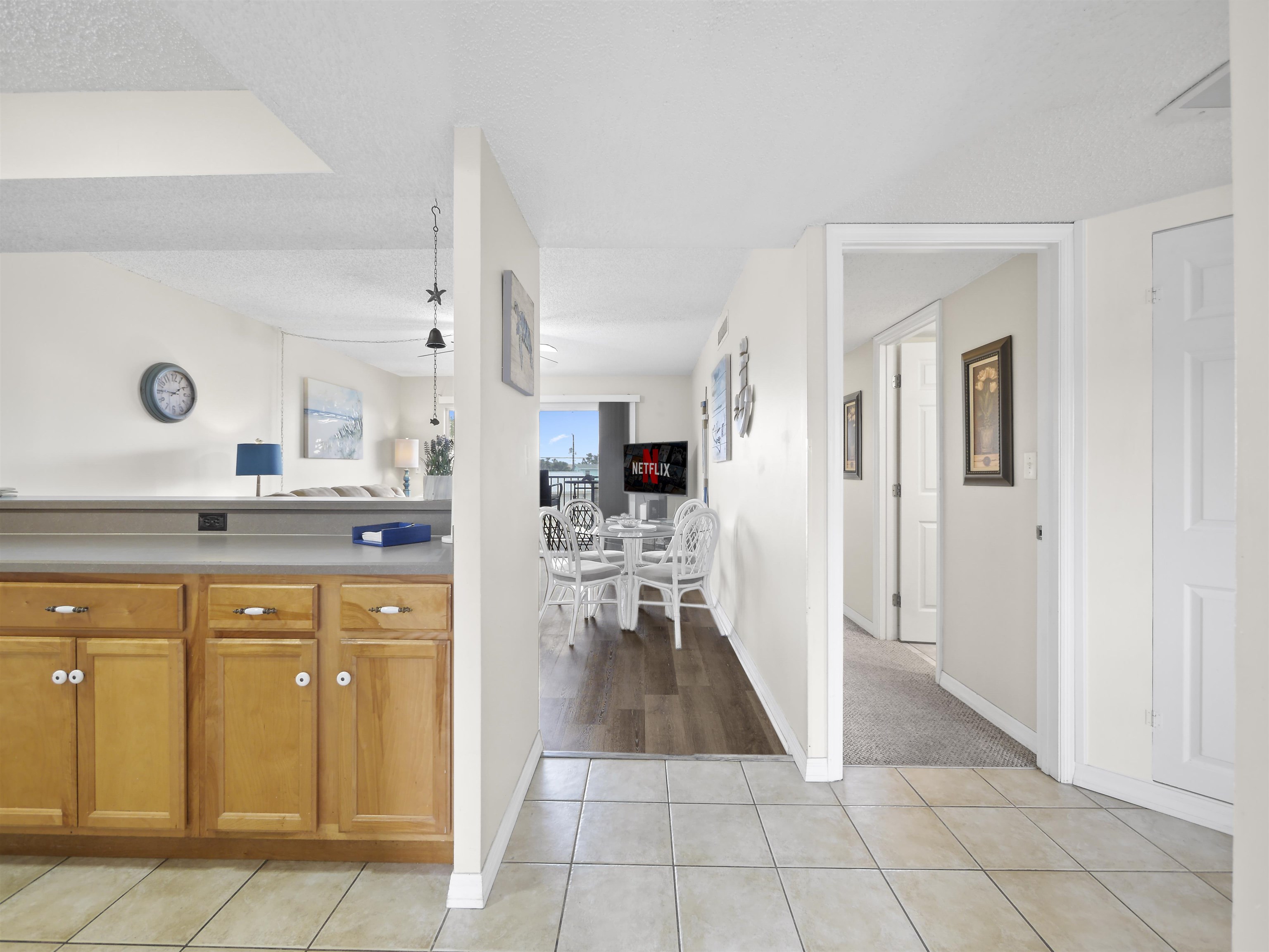 7175 A1A South St. Augustine, FL 32080 - Photo 14 of 35 a view of a kitchen with kitchen island cabinets and refrigerator