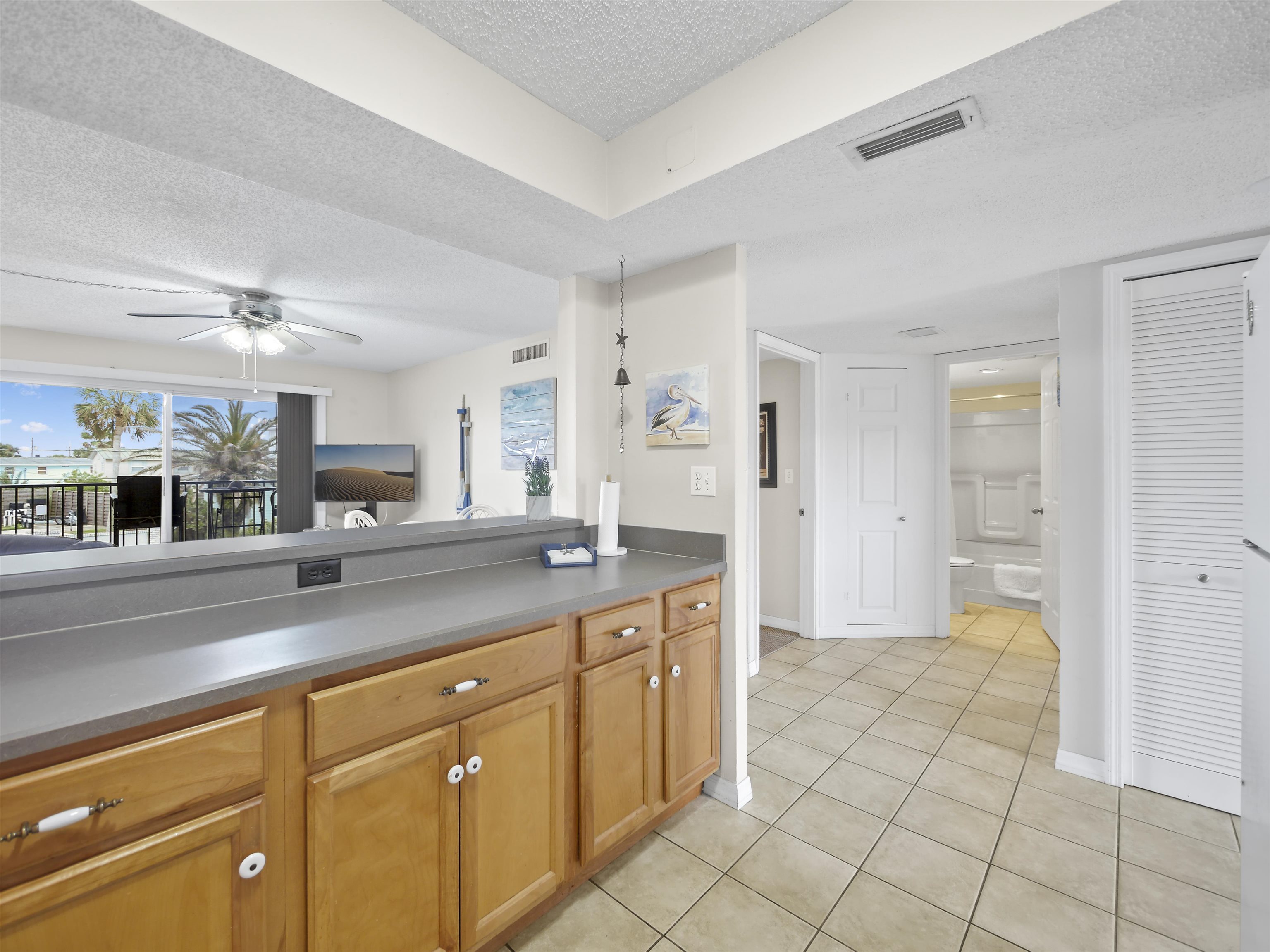 7175 A1A South St. Augustine, FL 32080 - Photo 16 of 35 a spacious bathroom with a granite countertop sink a mirror and a