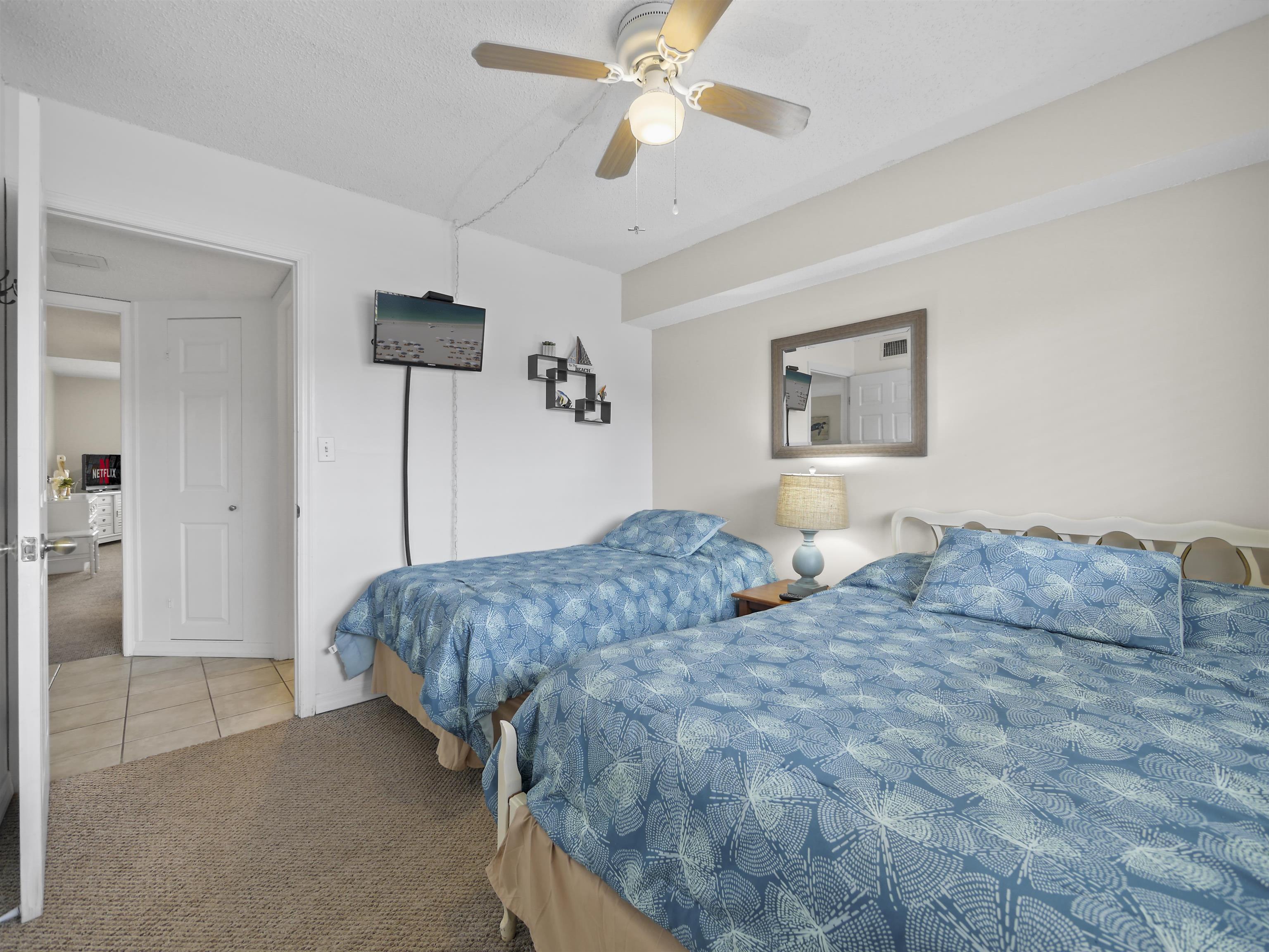 7175 A1A South St. Augustine, FL 32080 - Photo 23 of 35 a bedroom with a bed and ceiling fan