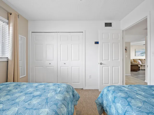 a bedroom with a bed and a walk in closet