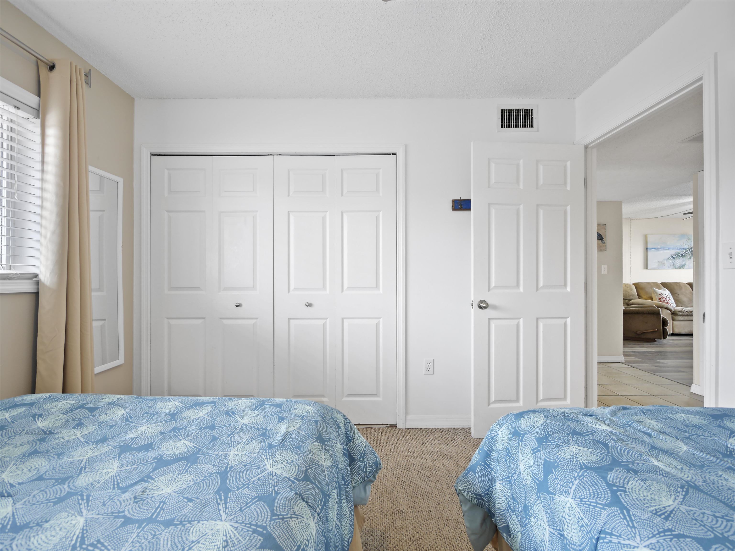 7175 A1A South St. Augustine, FL 32080 - Photo 24 of 35 a bedroom with a bed and a walk in closet