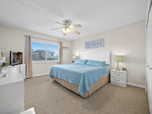 a spacious bedroom with a large bed and a window