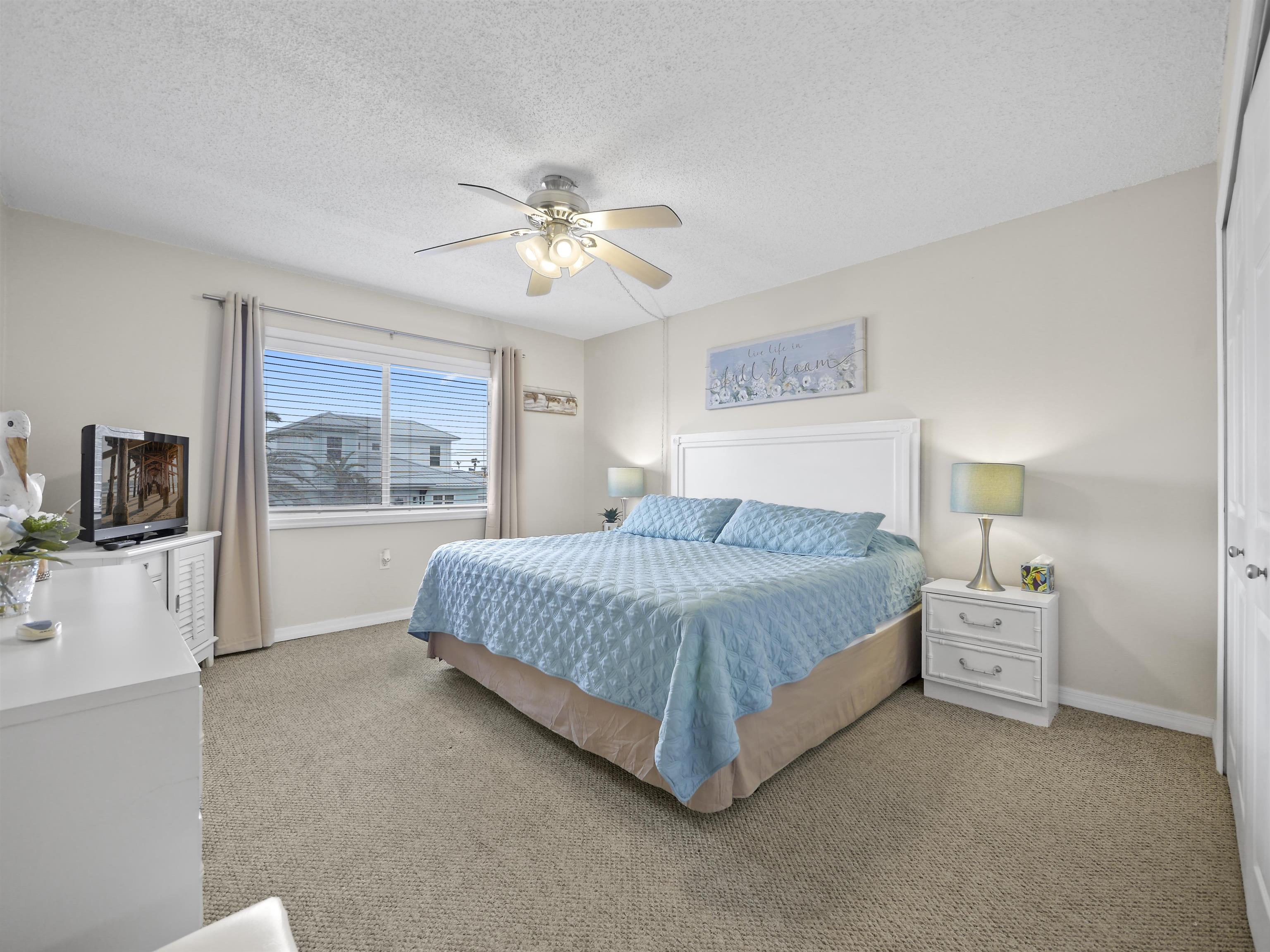 7175 A1A South St. Augustine, FL 32080 - Photo 3 of 35 a spacious bedroom with a large bed and a window