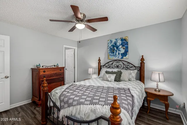 a bedroom with bed and dresser