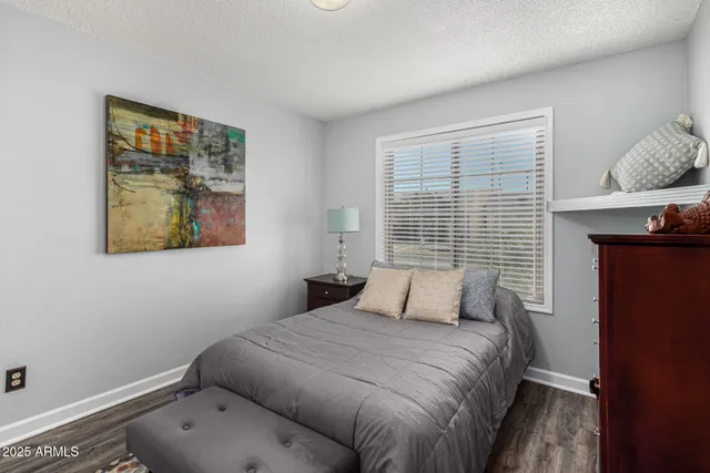 an empty room with closet and mirror