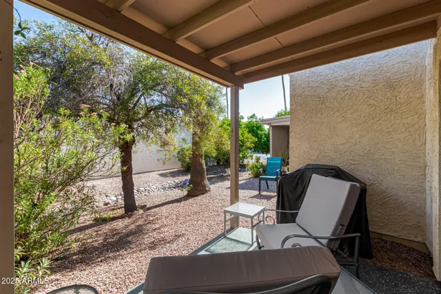 a view of a house with a tree