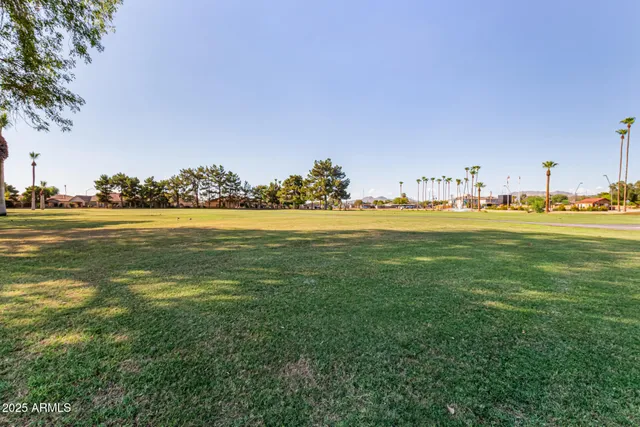 a view of swimming pool with outdoor seating