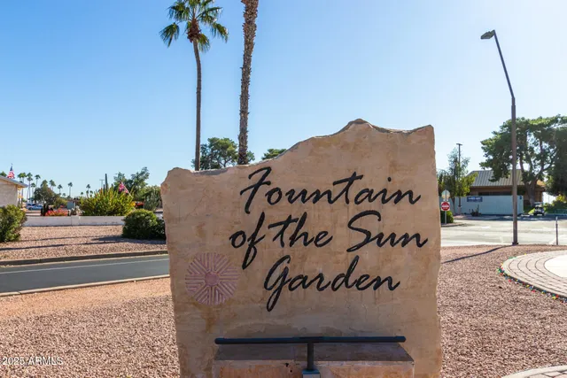a view of a lake with houses in the background