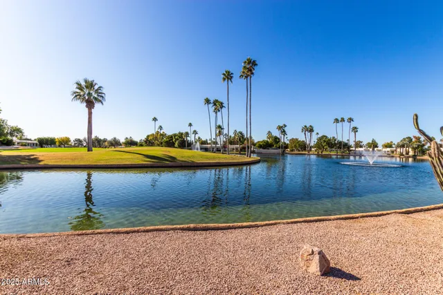a view of a swimming pool and an outdoor seating