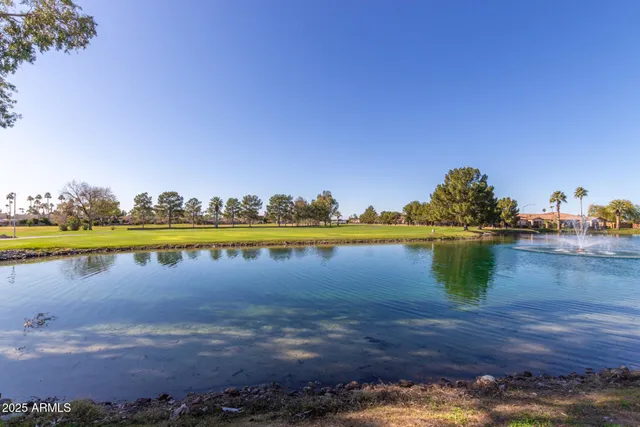 a view of swimming pool with outdoor space and lake view