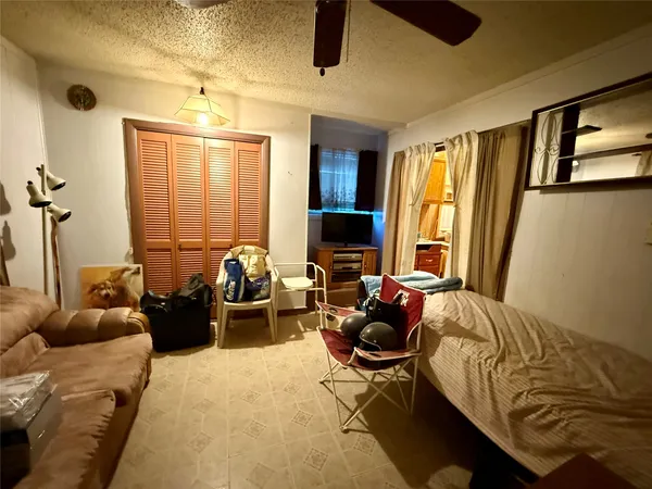a bed room with furniture and a window