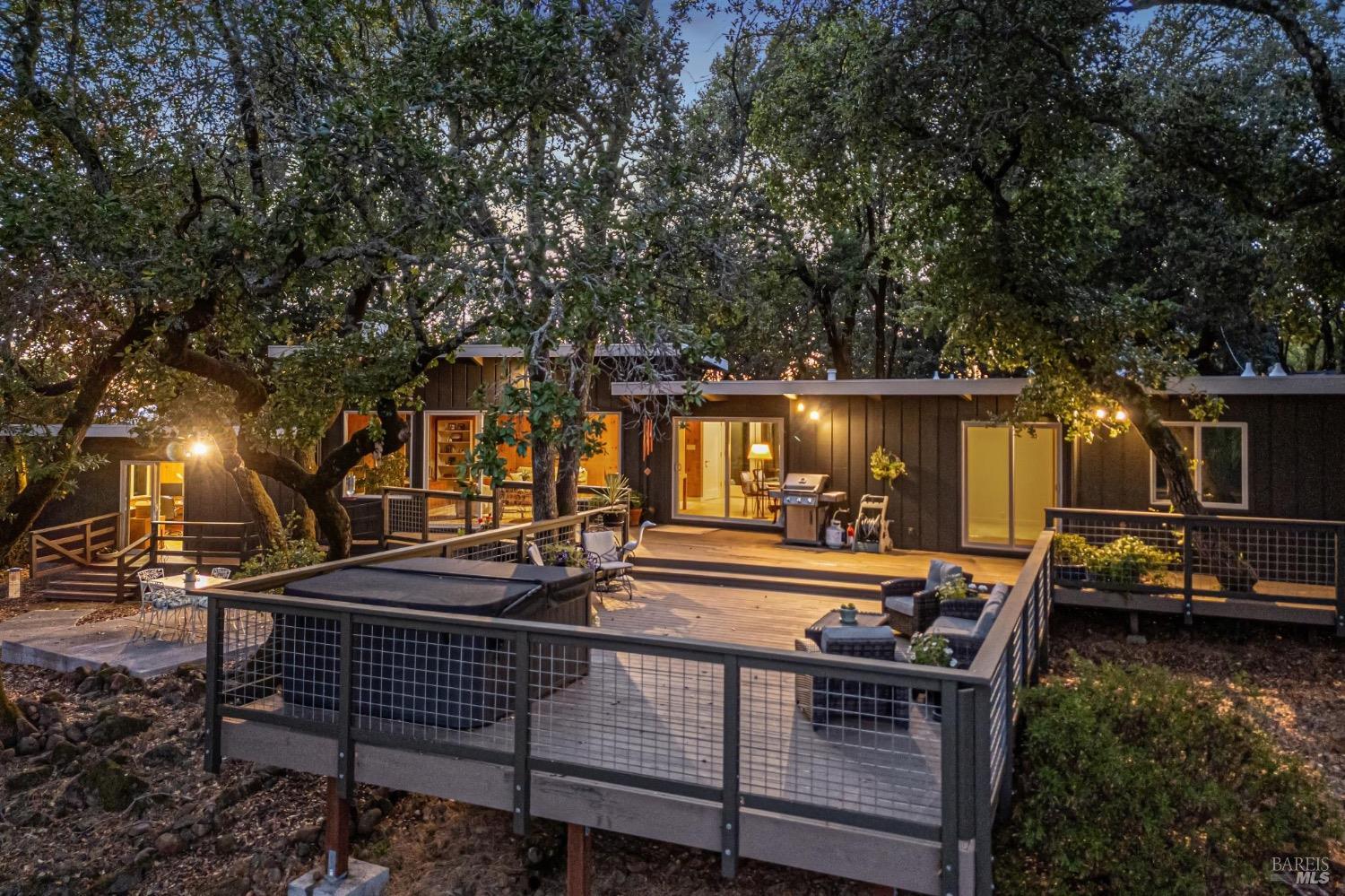 The large back deck is surrounded by trees and features stunning views of Sonoma Mountains. Peacefully take in the views from your hot tub or have a dinner party alfresco with ample room for seating and entertainment.