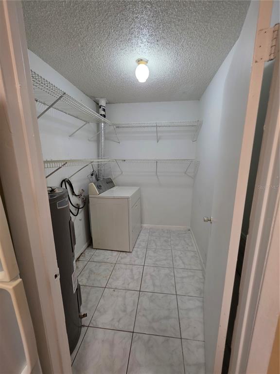 1836 Southwest 109th Place Ocala, FL 34476 - Photo 12 of 24 a bathroom with a sink and washing machine