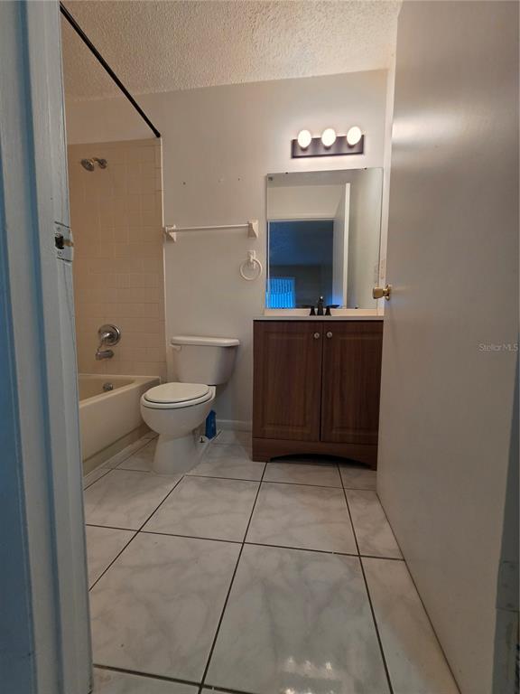 1836 Southwest 109th Place Ocala, FL 34476 - Photo 14 of 24 a bathroom with a toilet a sink and mirror