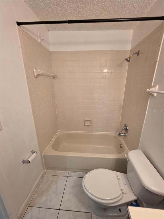 1836 Southwest 109th Place Ocala, FL 34476 - Photo 16 of 24 a bathroom with a toilet and a bath tub
