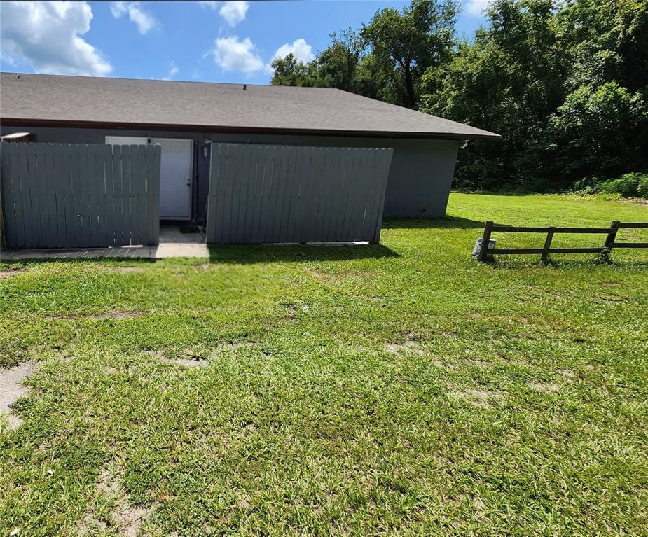 1836 Southwest 109th Place Ocala, FL 34476 - Photo 2 of 24 a backyard of a house